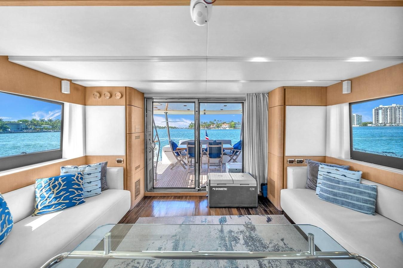 a living room with a large glass door aboard AICON 85 Yacht for Sale