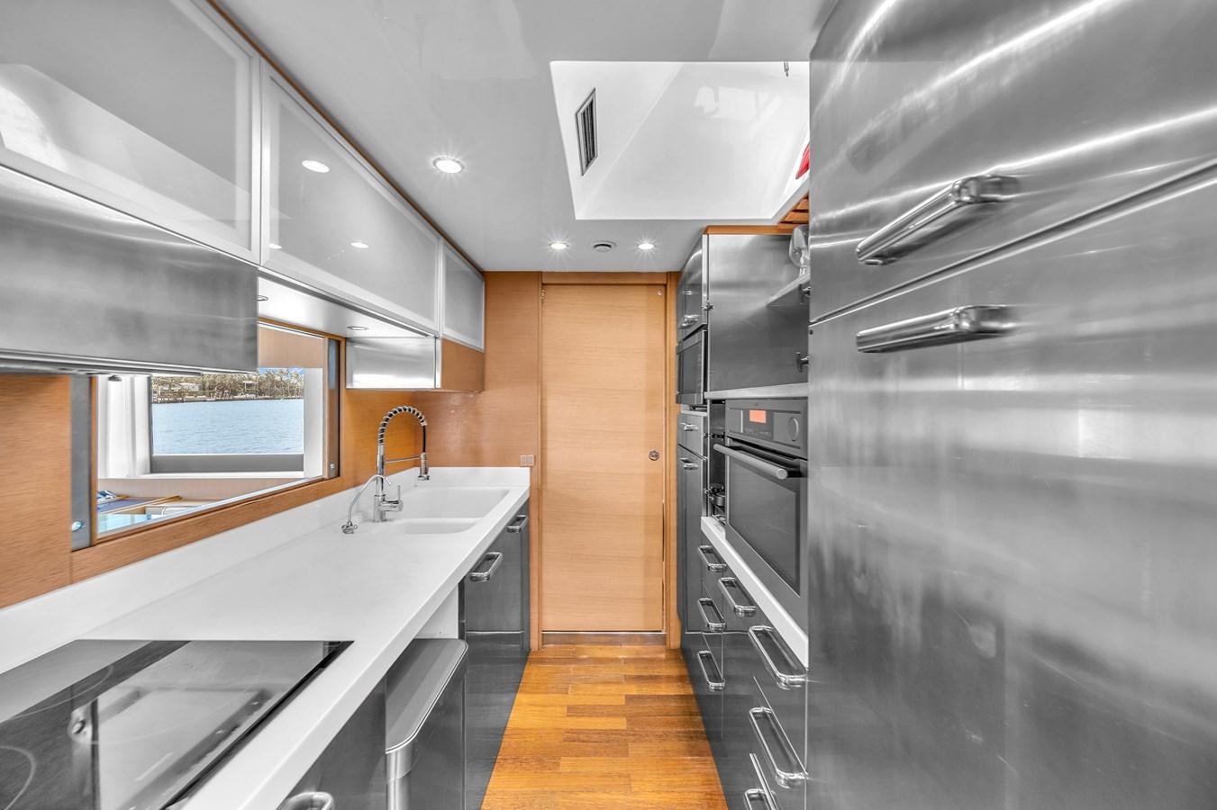 a kitchen with a large island aboard AICON 85 Yacht for Sale