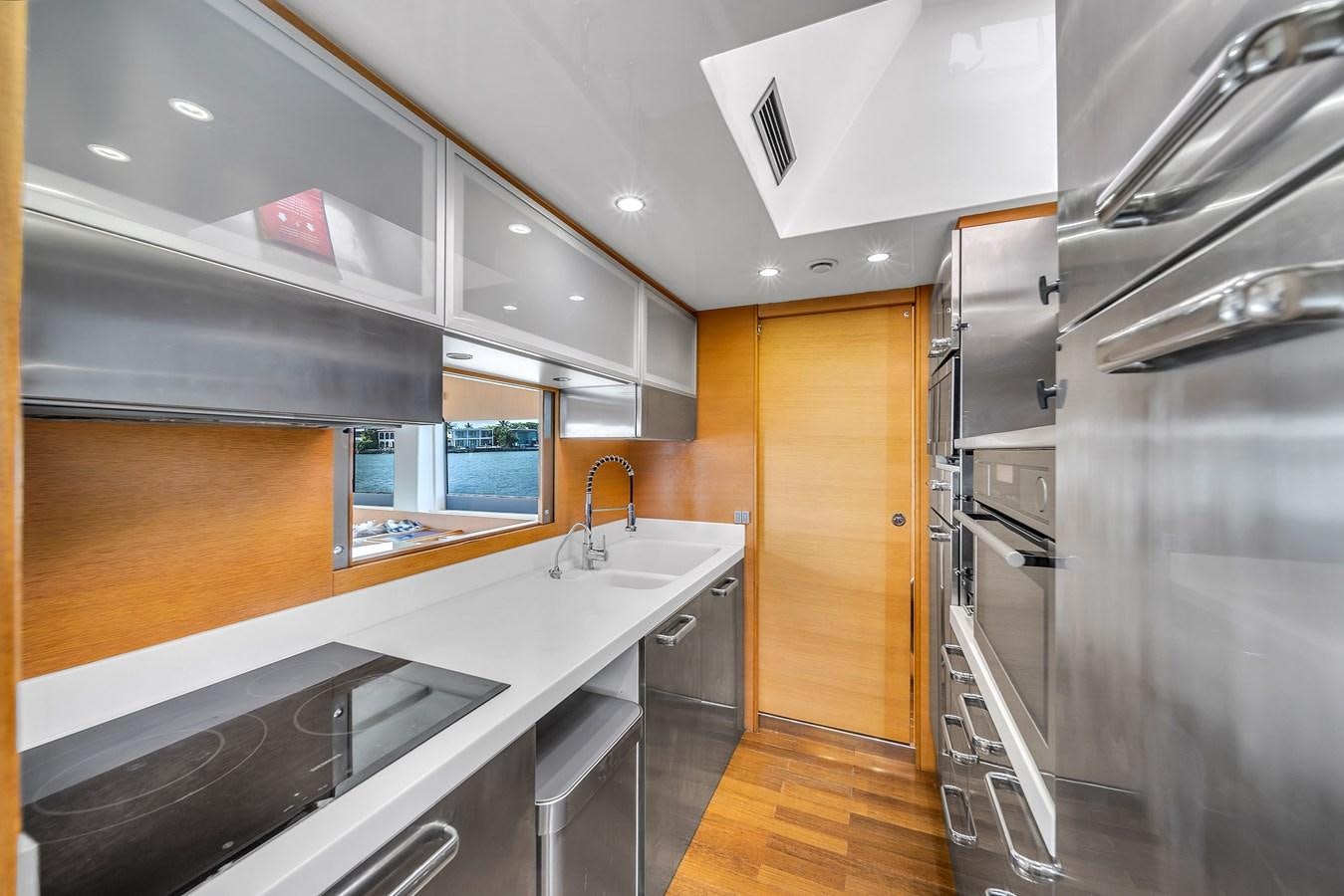 a kitchen with stainless steel appliances aboard AICON 85 Yacht for Sale