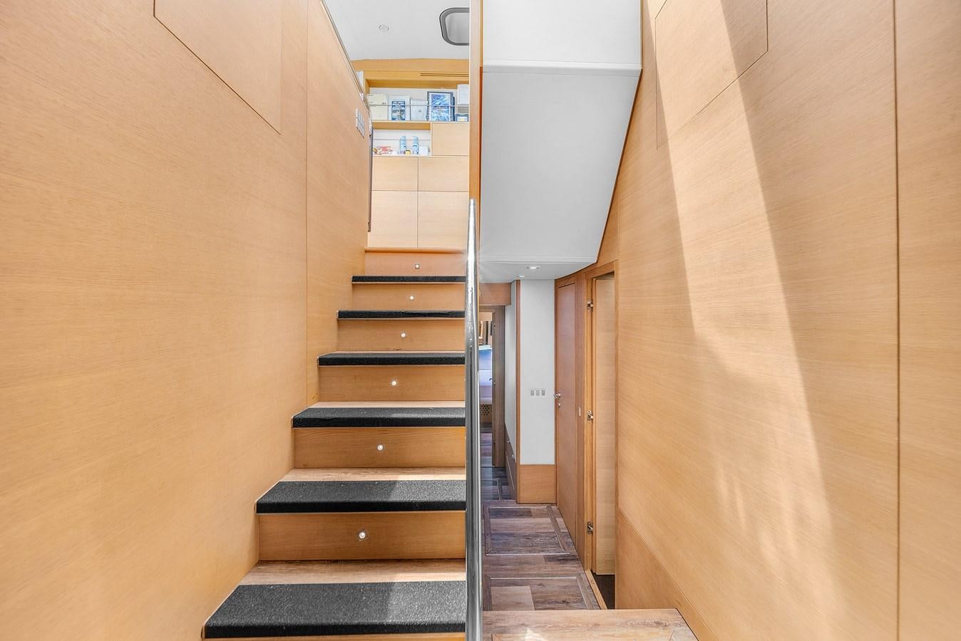 a staircase with a set of wooden stairs aboard AICON 85 Yacht for Sale