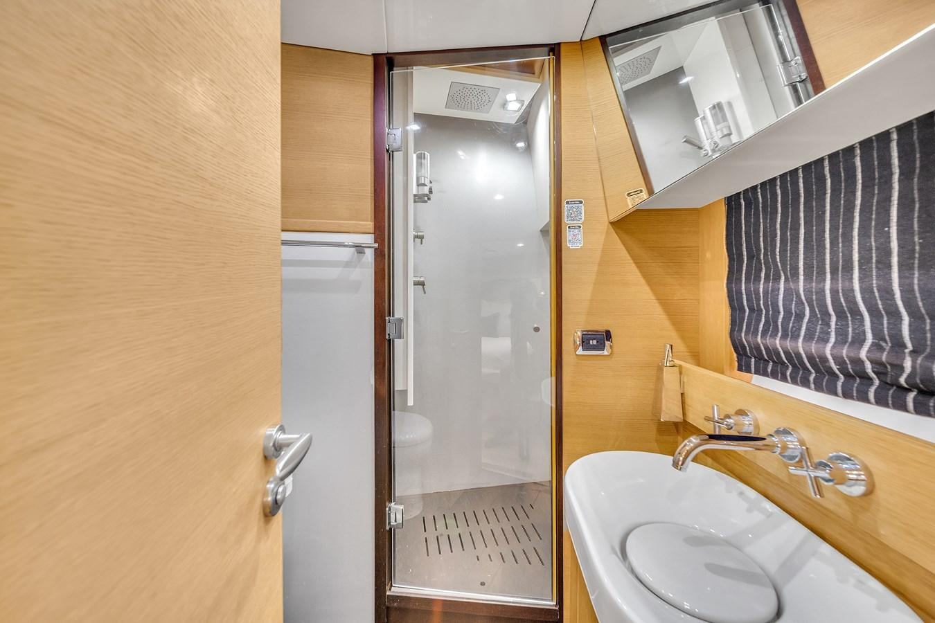 a bathroom with a sink and a mirror aboard AICON 85 Yacht for Sale