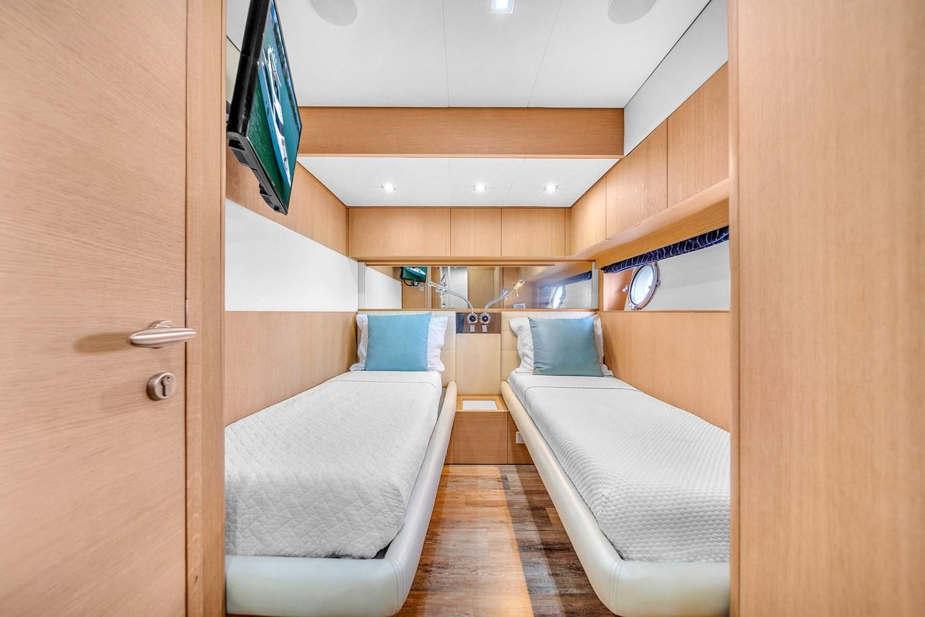 a room with a bed and a chair aboard AICON 85 Yacht for Sale