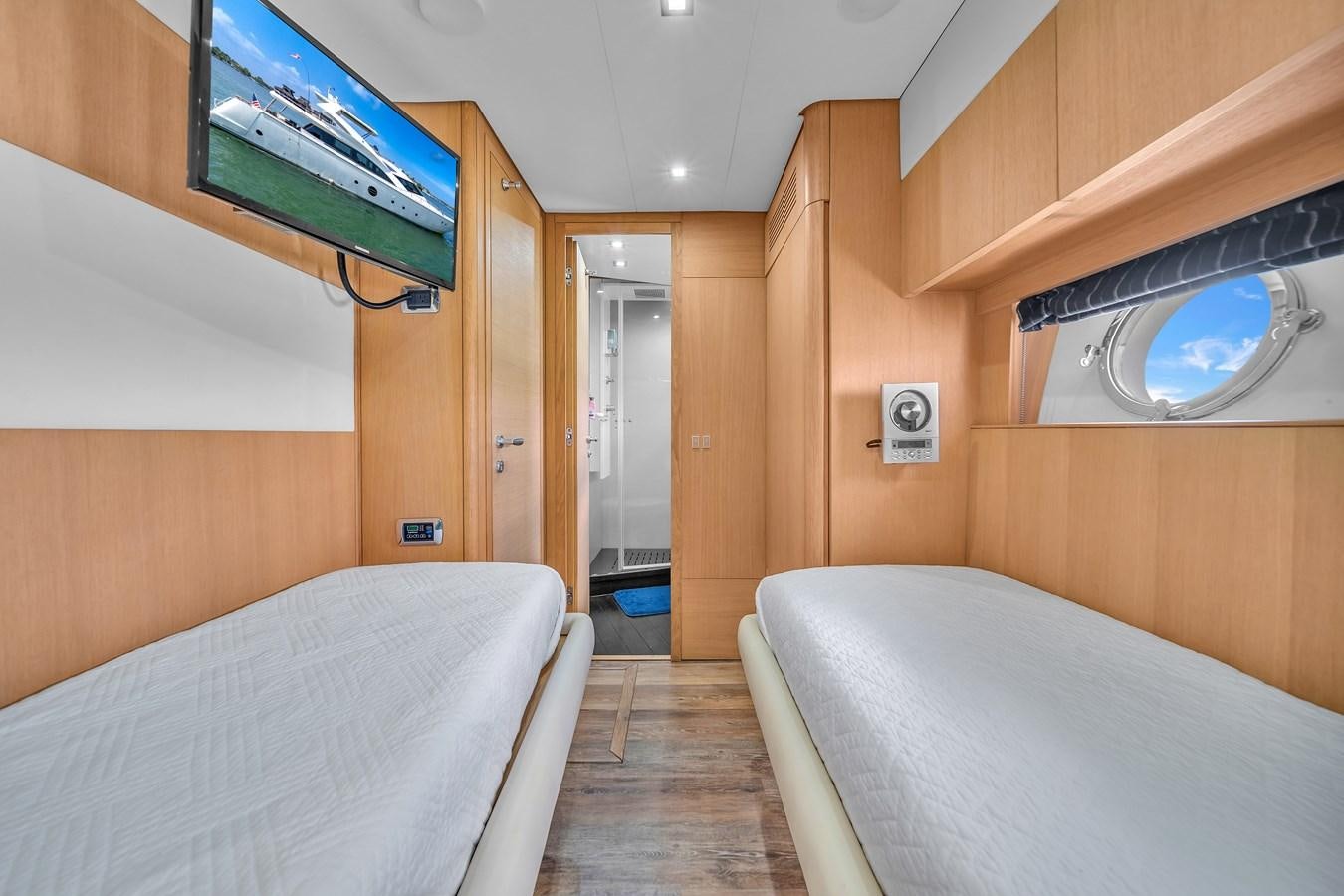 a room with a bed and a television aboard AICON 85 Yacht for Sale