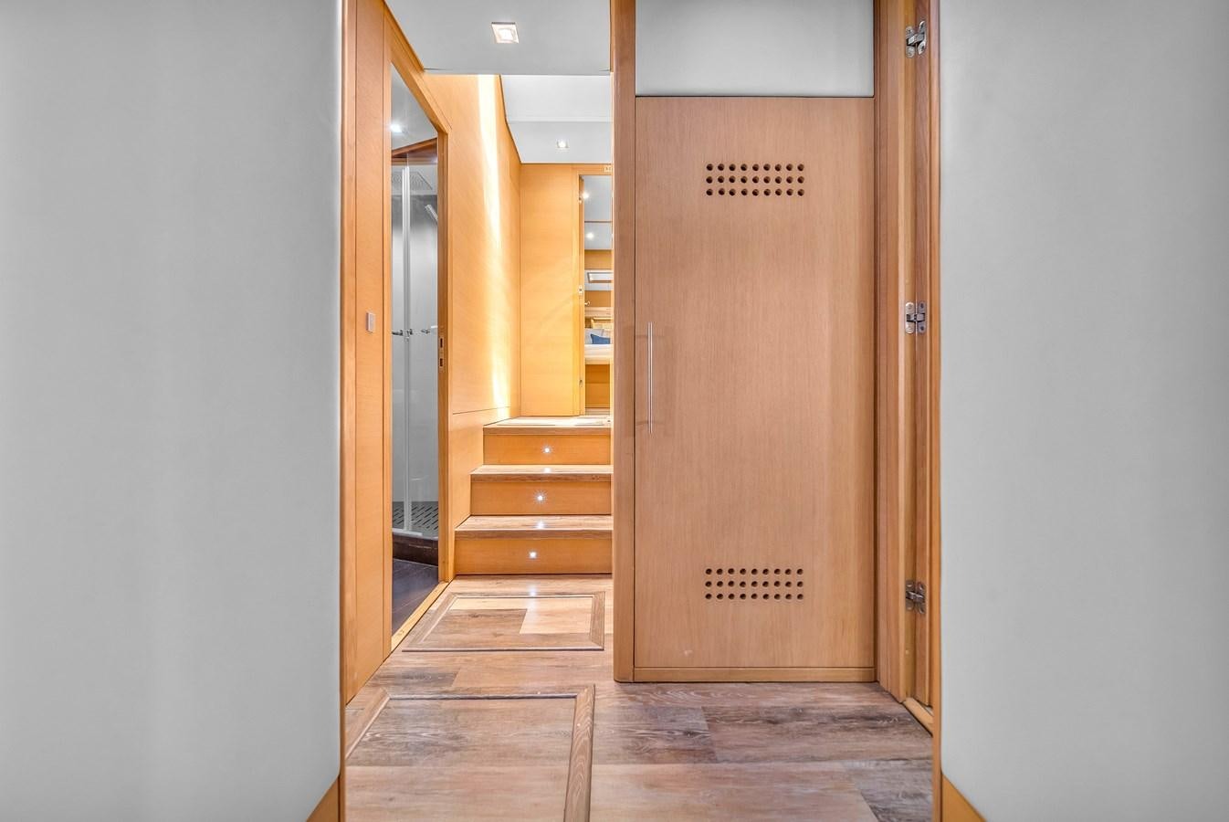 a room with doors and a wood door aboard AICON 85 Yacht for Sale
