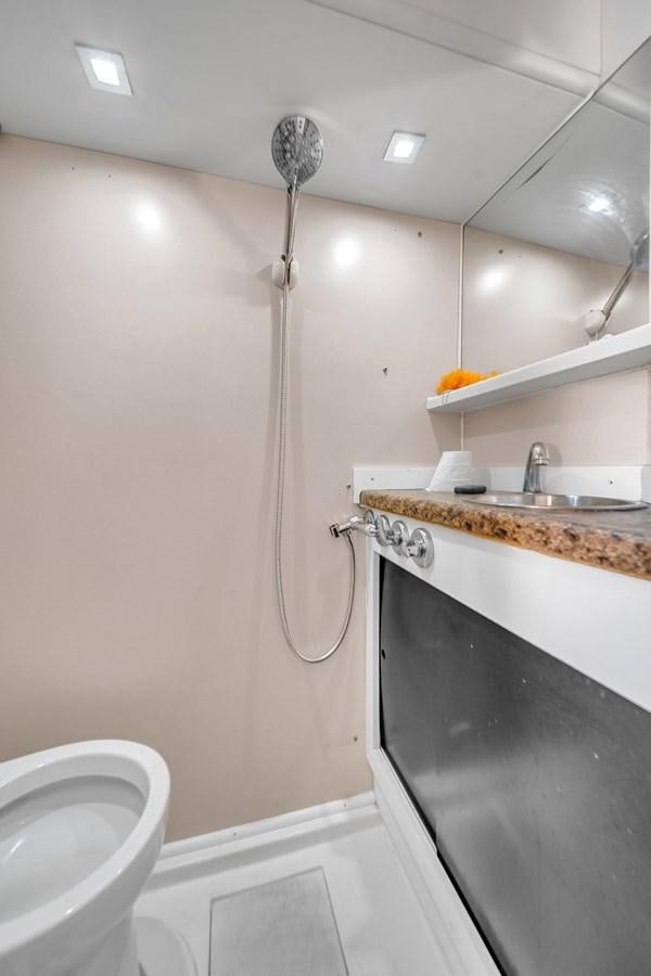 a bathroom with a sink and a shower head aboard AICON 85 Yacht for Sale