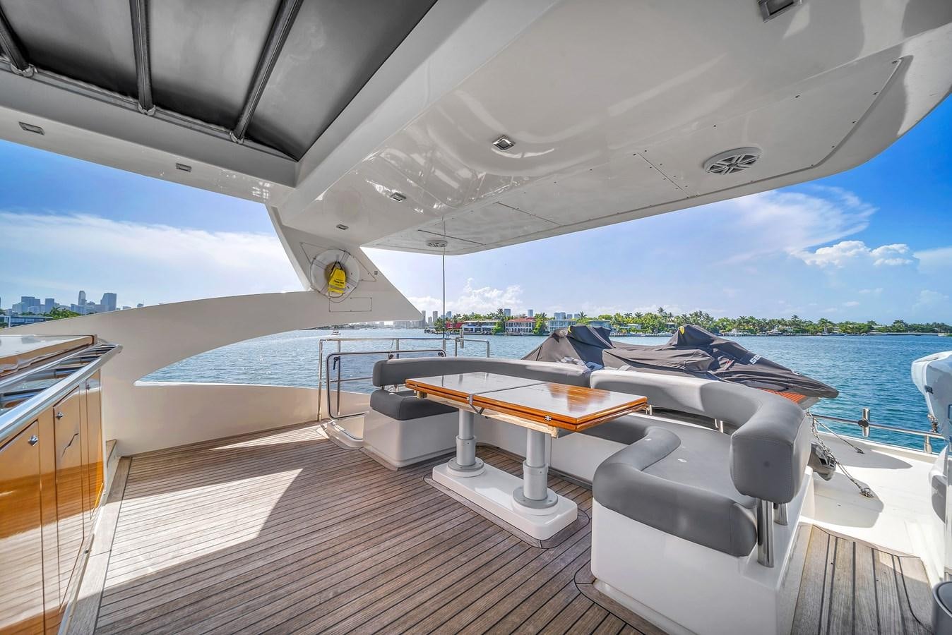 a deck with a view of the water and the land below aboard AICON 85 Yacht for Sale