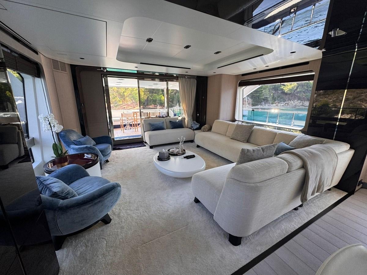 a living room with a large window aboard BETTY Yacht for Sale