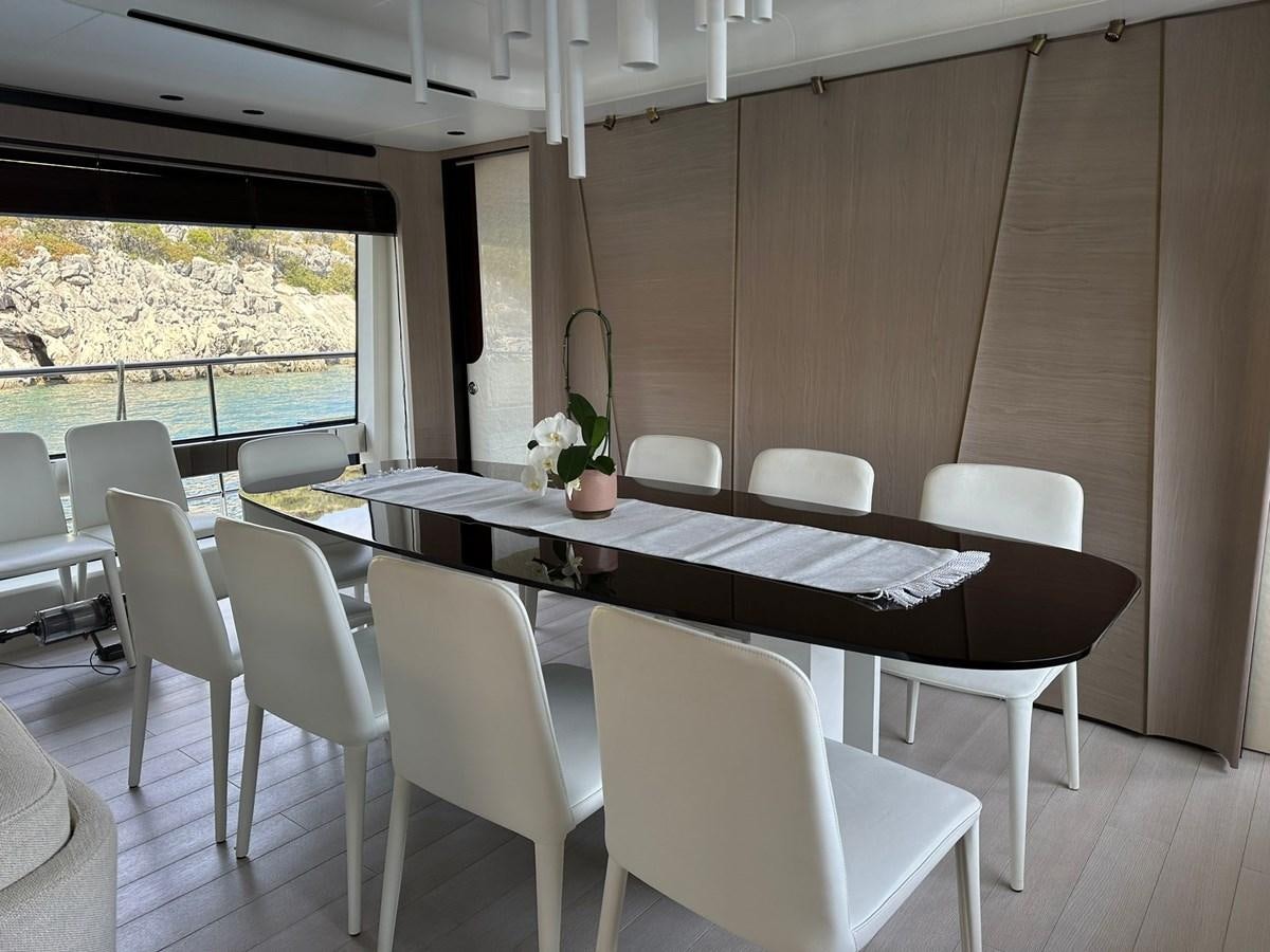 a room with a table and chairs aboard BETTY Yacht for Sale