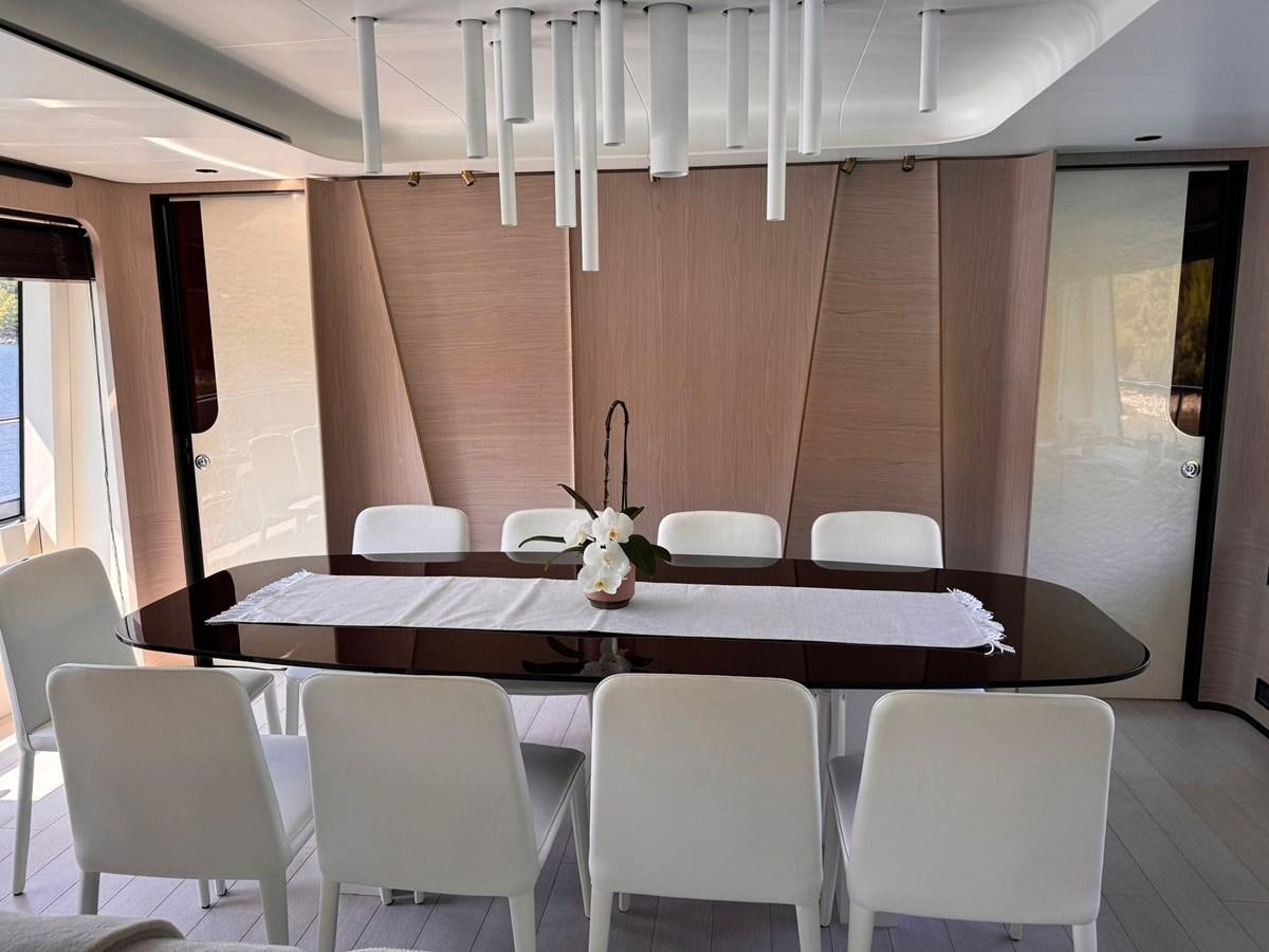 a room with a table and chairs aboard BETTY Yacht for Sale