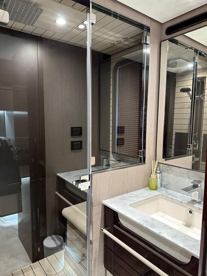a bathroom with a glass shower aboard BETTY Yacht for Sale