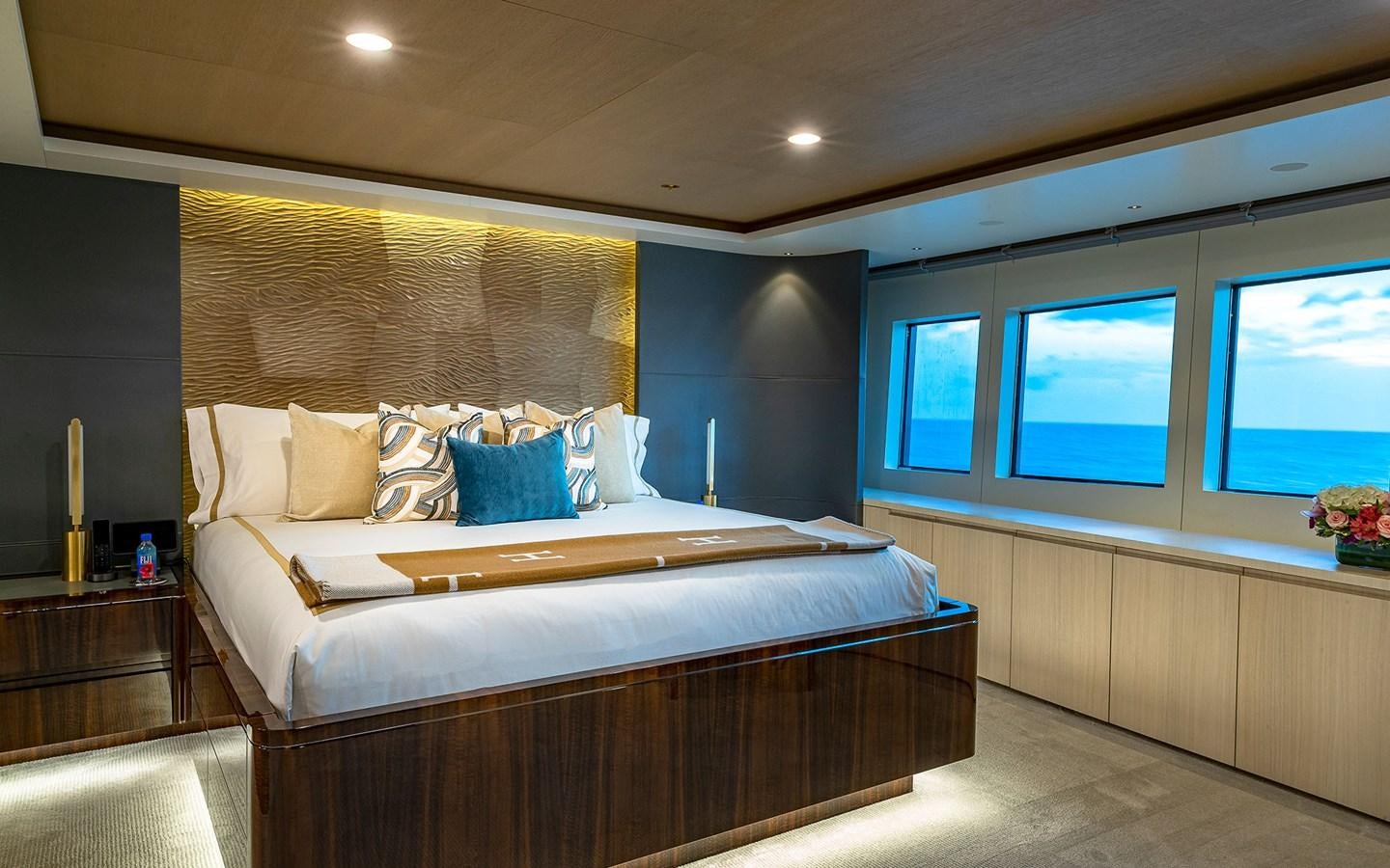 a bedroom with a large bed aboard REVERIE Yacht for Sale