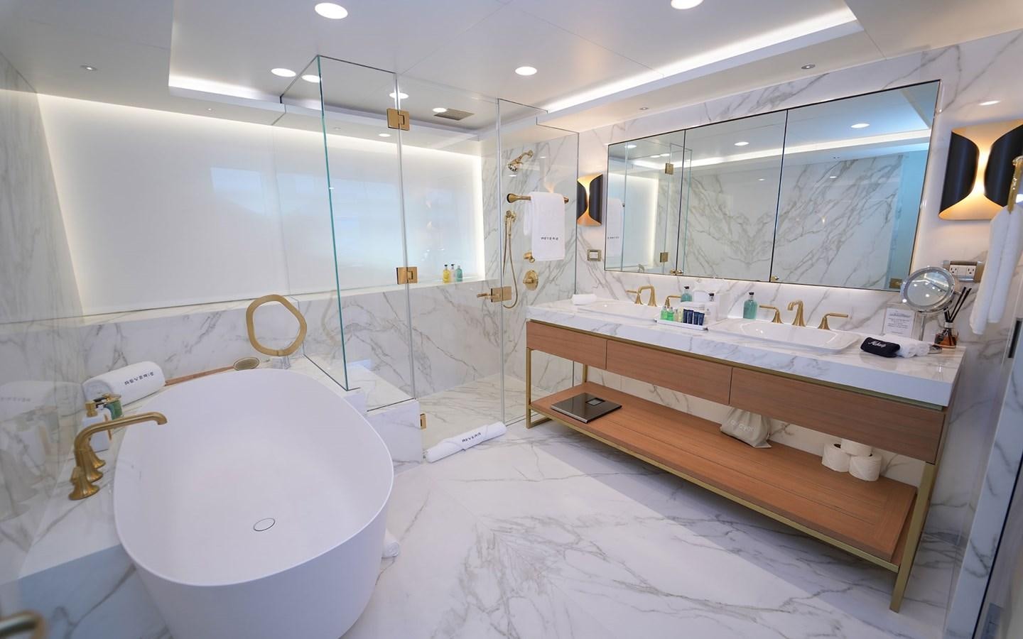 a bathroom with a large mirror aboard REVERIE Yacht for Sale