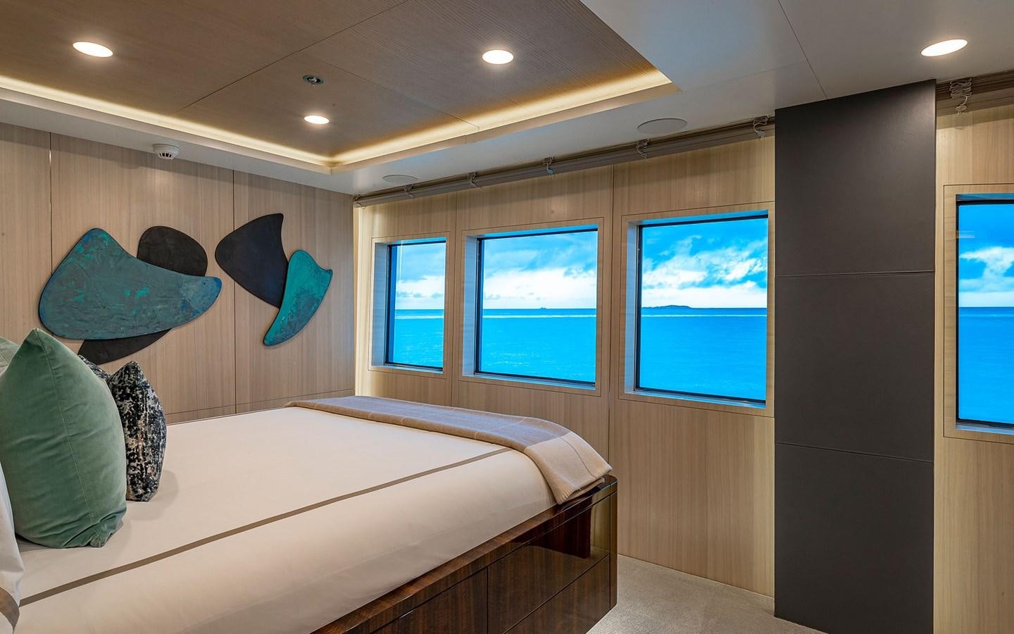 a bedroom with a large bed aboard REVERIE Yacht for Sale