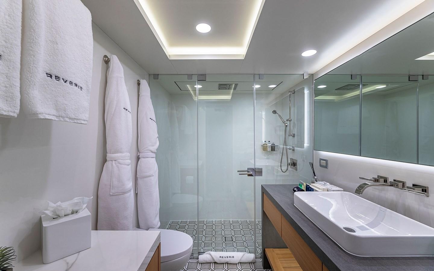 a bathroom with a shower and sink aboard REVERIE Yacht for Sale