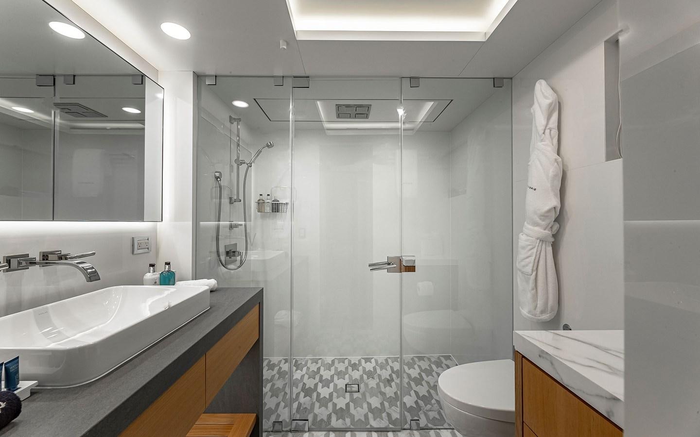 a bathroom with a glass shower aboard REVERIE Yacht for Sale