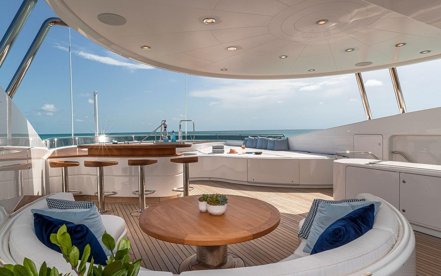 a modern looking living room with a large balcony aboard REVERIE Yacht for Sale