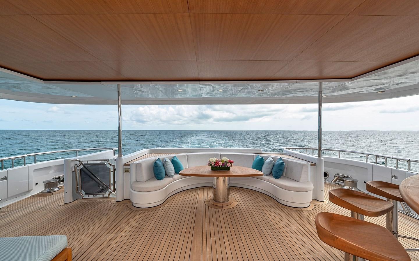 a room with a table and chairs aboard REVERIE Yacht for Sale