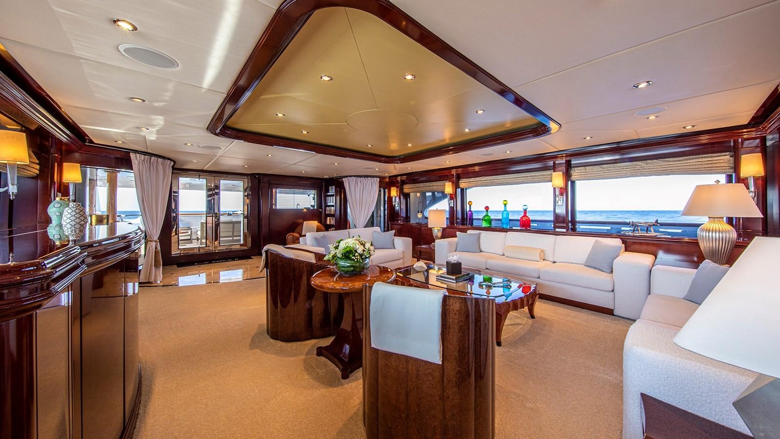 a large living room with a large open floor plan aboard LA DEA II Yacht for Sale