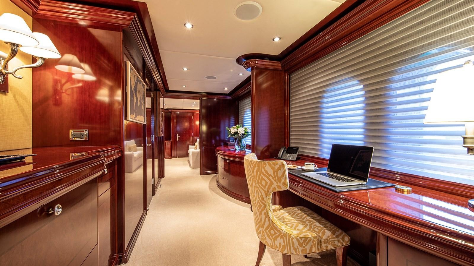 a room with a desk and a laptop aboard LA DEA II Yacht for Sale