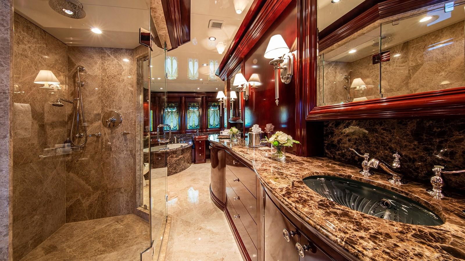 a bathroom with marble counter tops aboard LA DEA II Yacht for Sale
