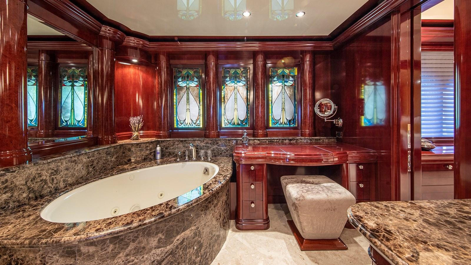 a bathroom with a large bathtub aboard LA DEA II Yacht for Sale