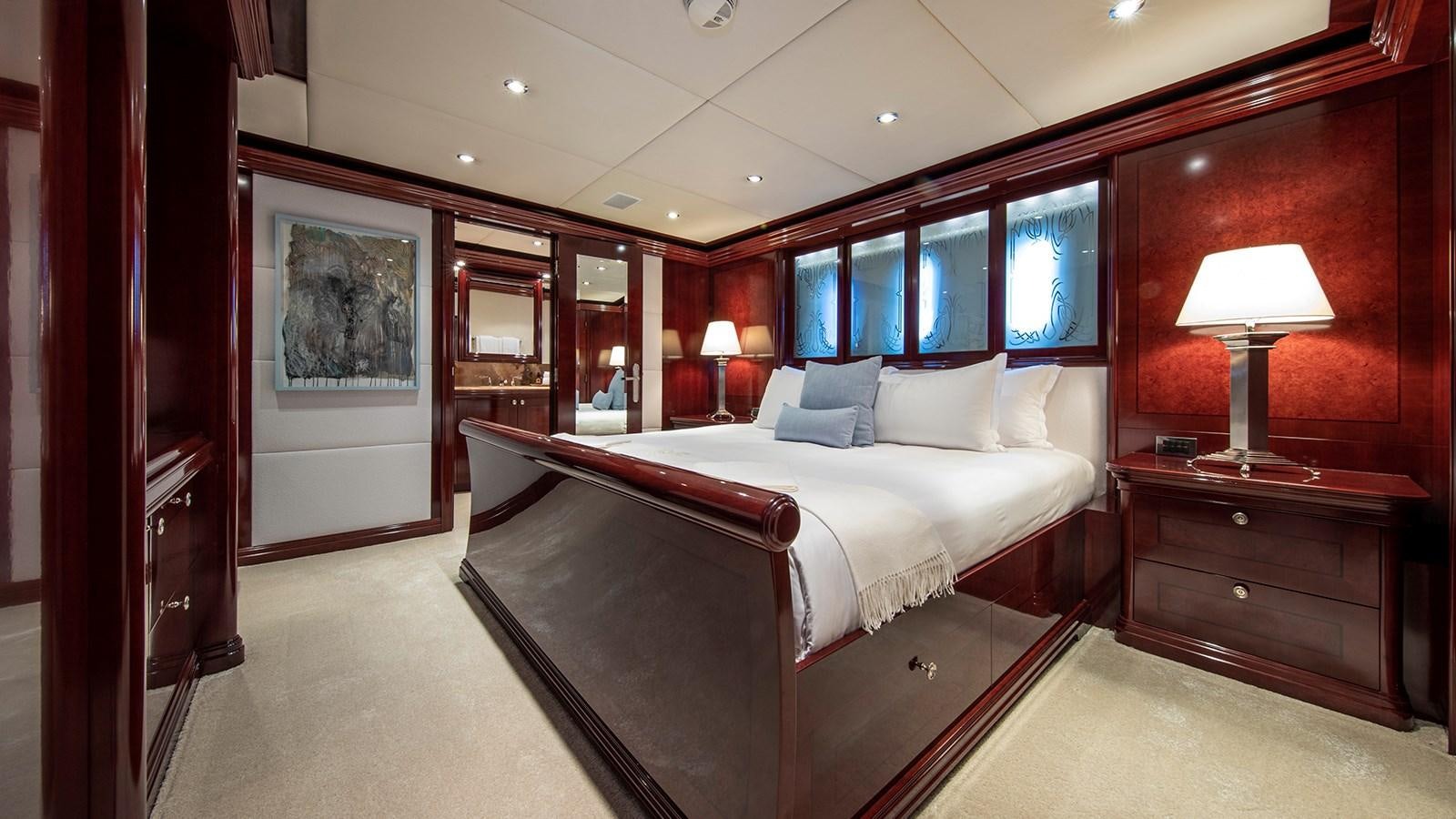a large bed in a room aboard LA DEA II Yacht for Sale