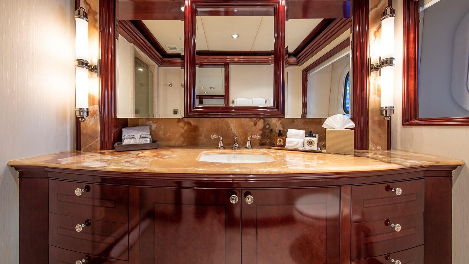 a bathroom with a large mirror aboard LA DEA II Yacht for Sale