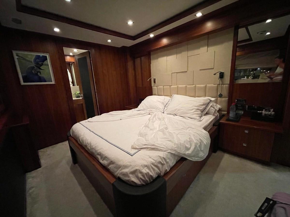 a bedroom with a bed and a mirror aboard SOLARIS Yacht for Sale