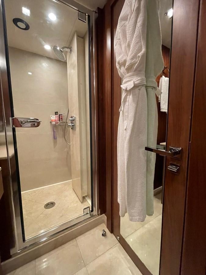 a bathroom with a shower curtain aboard SOLARIS Yacht for Sale