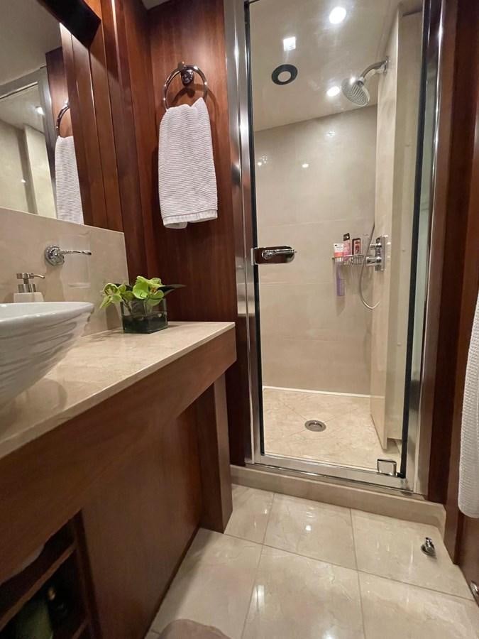 a bathroom with a sink and a shower aboard SOLARIS Yacht for Sale
