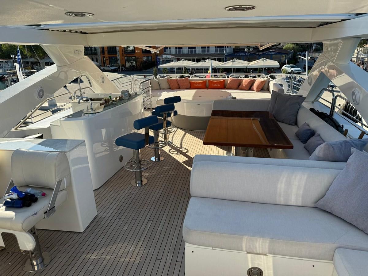 a room with a couch and a table aboard SOLARIS Yacht for Sale