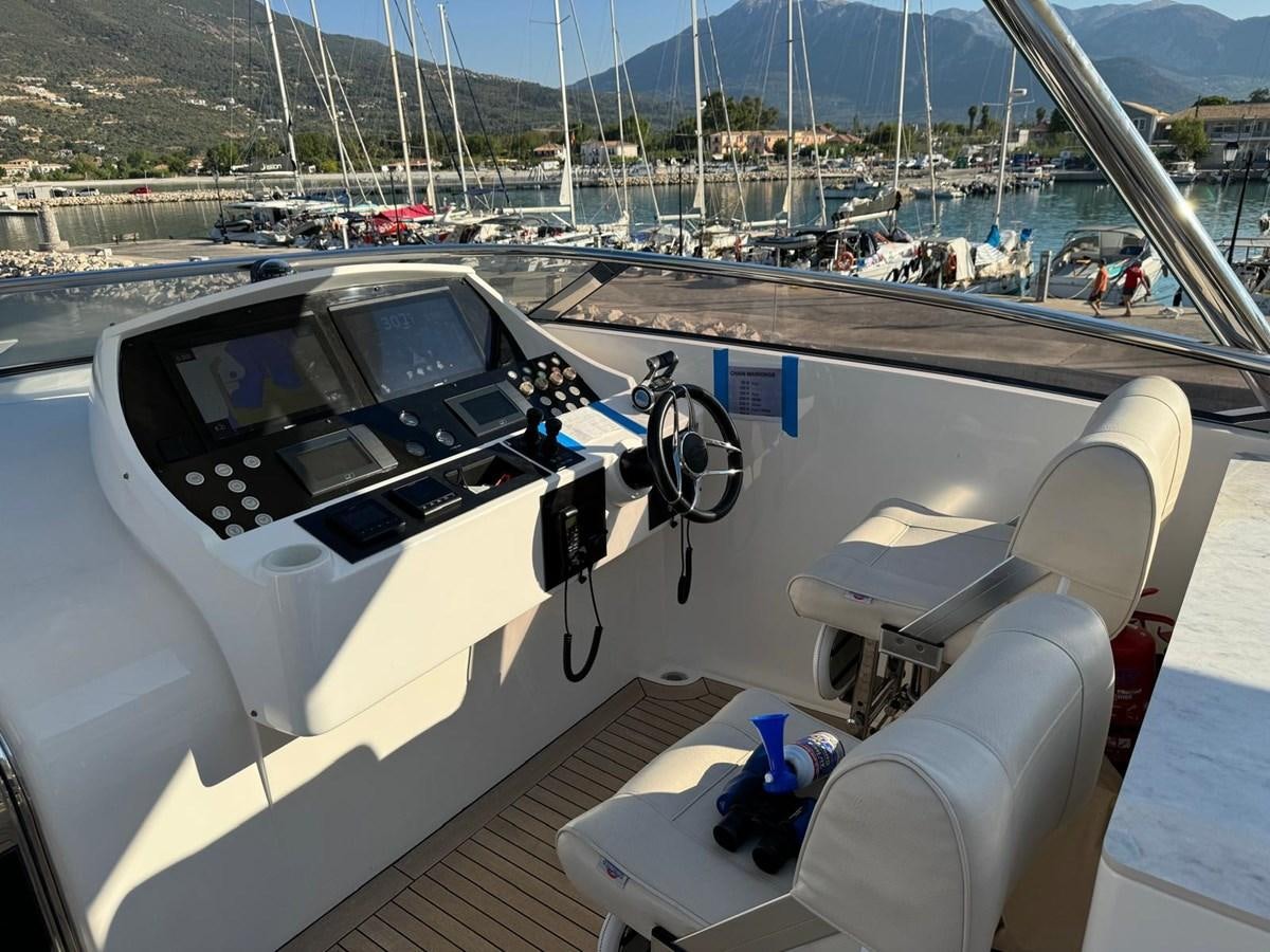 a white car on a boat aboard SOLARIS Yacht for Sale
