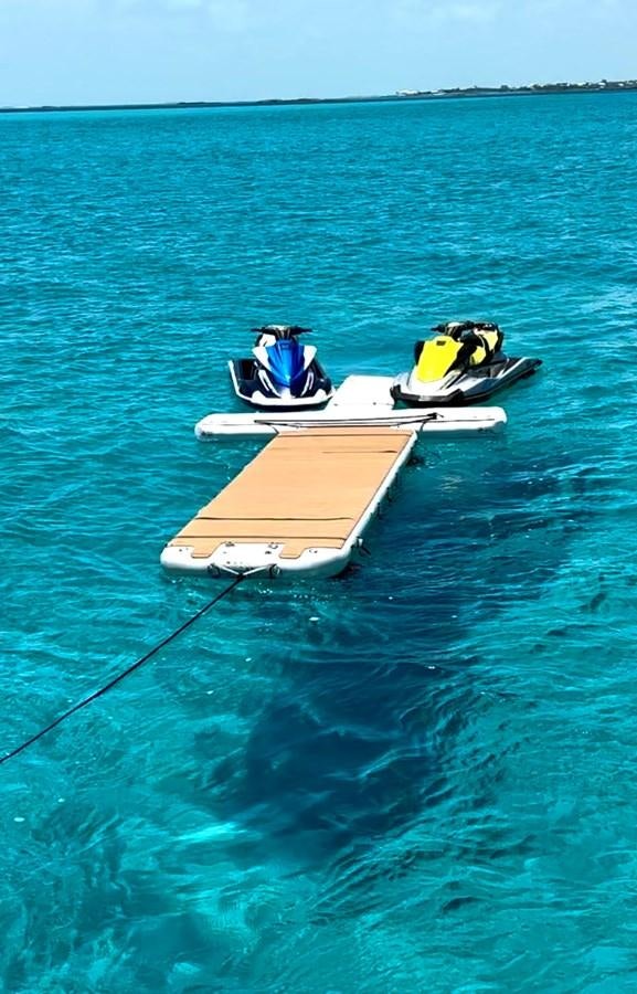 a couple of boats on the water aboard SOLARIS Yacht for Sale