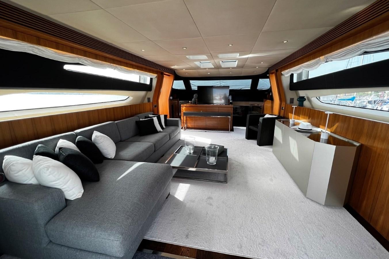 a large room with a couch and a table aboard SCORPIO Yacht for Sale