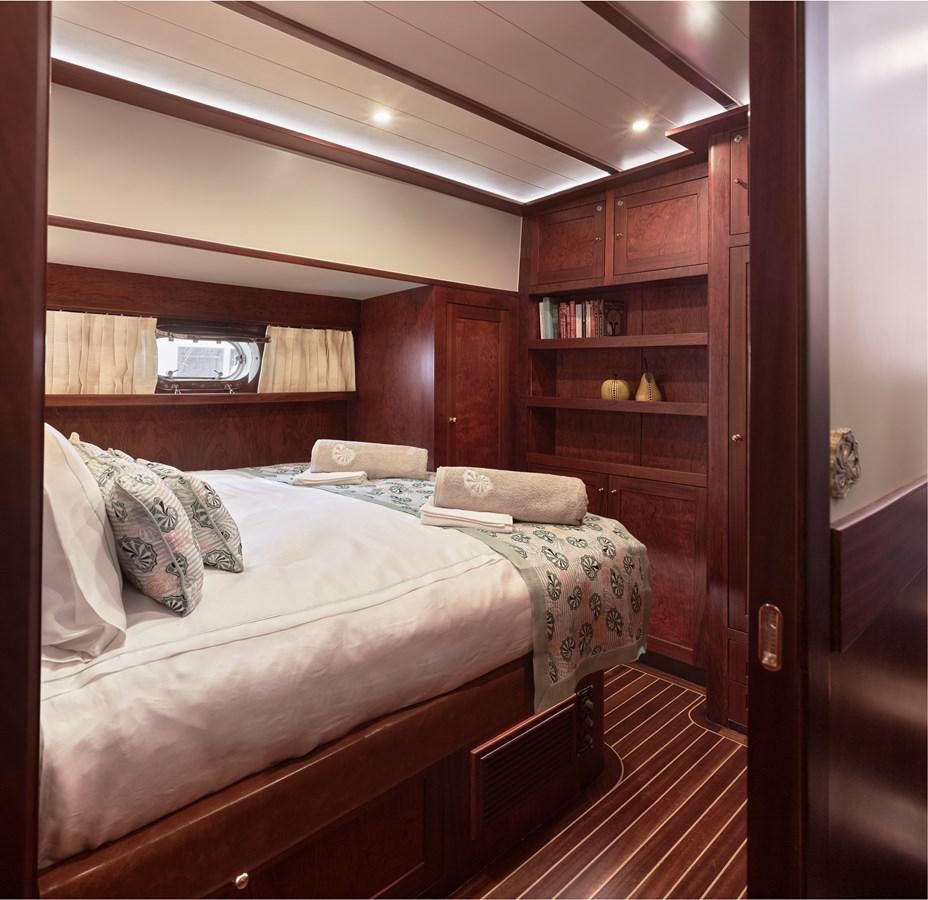 a bed in a room aboard KAFTAN Yacht for Sale