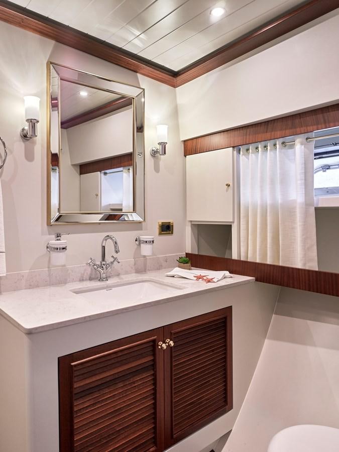 a bathroom with a large mirror aboard KAFTAN Yacht for Sale