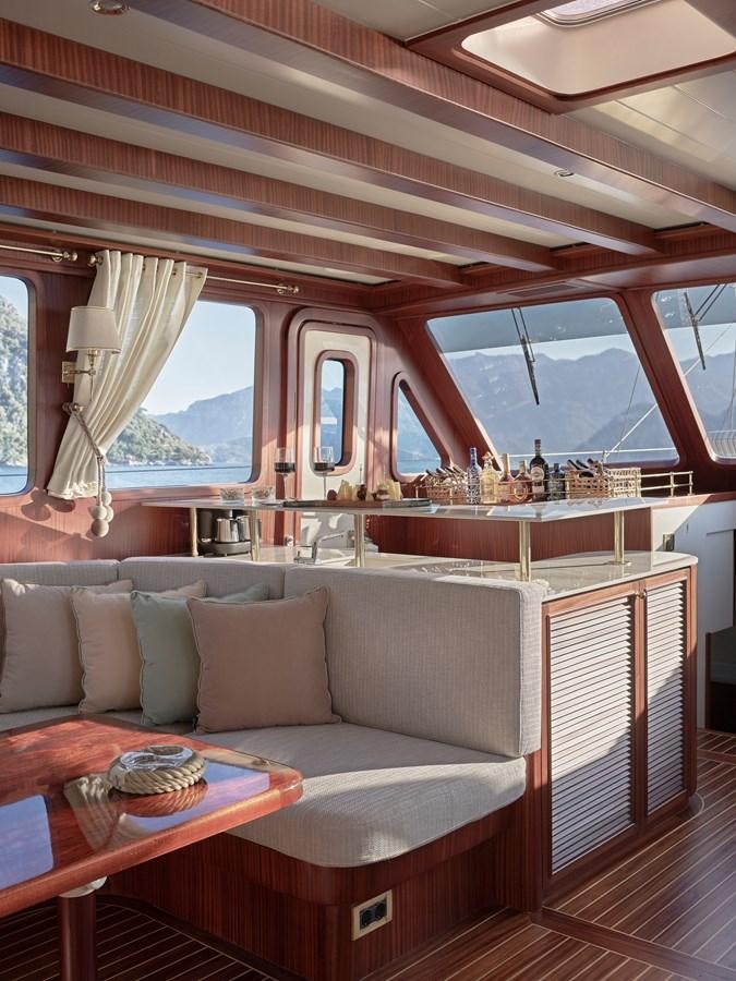 a living room with a large window aboard KAFTAN Yacht for Sale