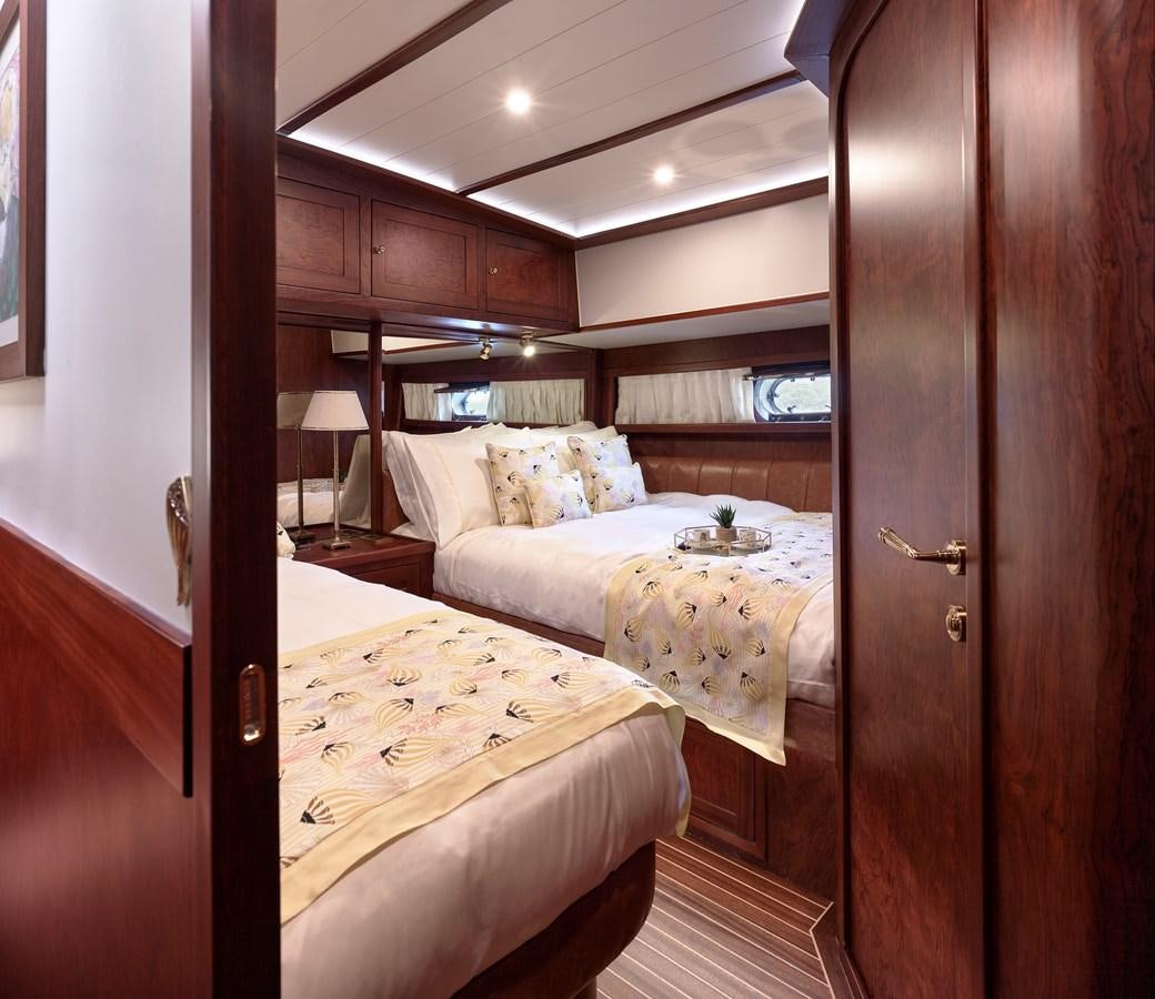 a room with two beds aboard KAFTAN Yacht for Sale