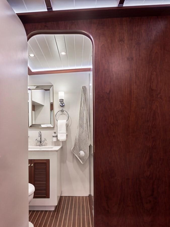 a bathroom with a sink and a mirror aboard KAFTAN Yacht for Sale