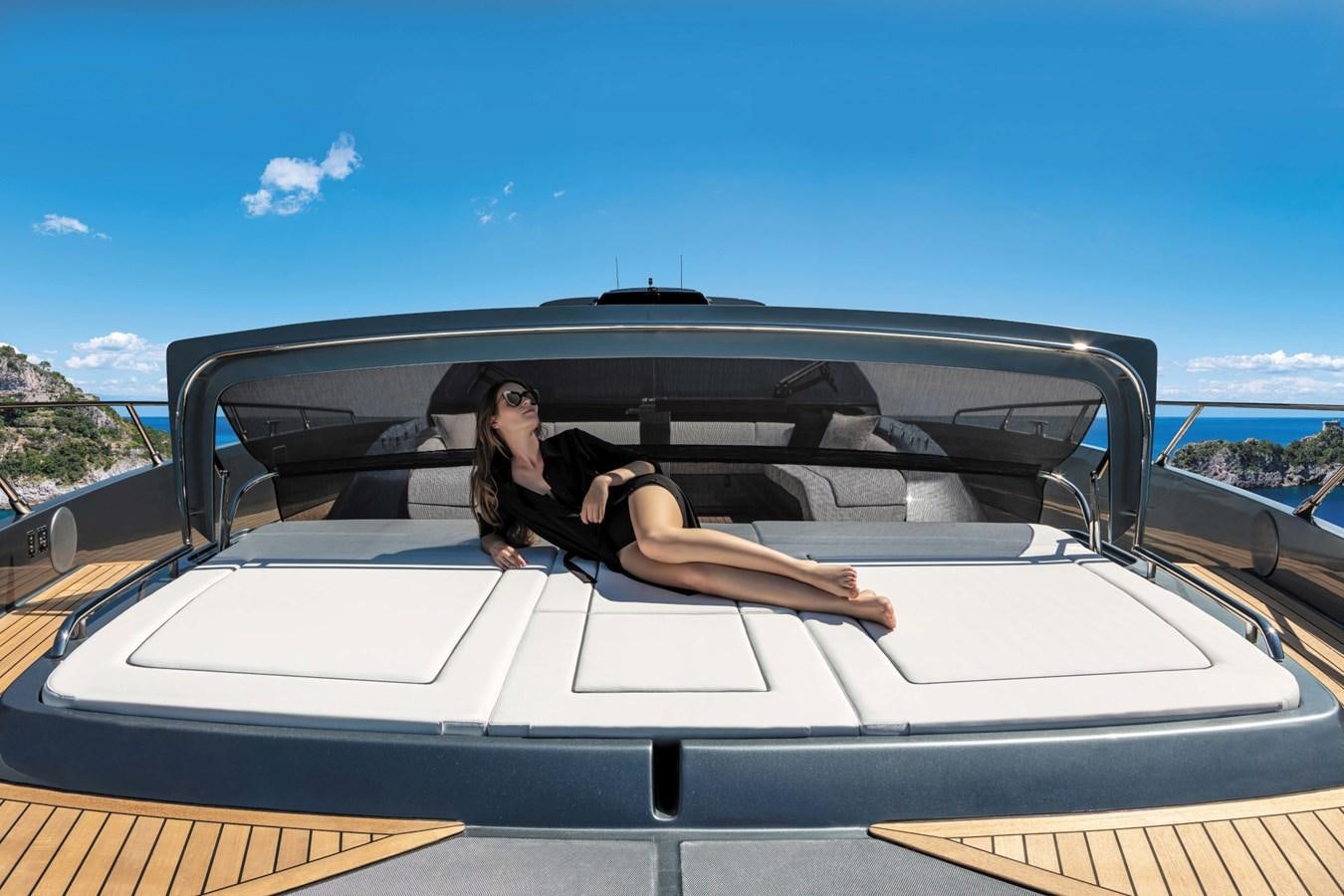a person sitting in a convertible car aboard RIVA FOLGORE 88/24 Yacht for Sale