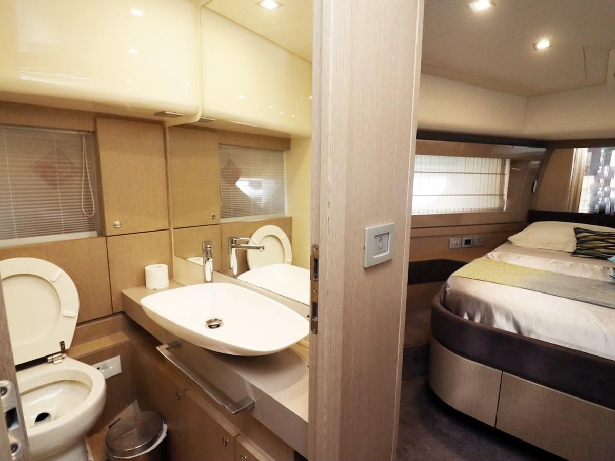 a bathroom with a sink and a bed aboard SONIA Yacht for Sale