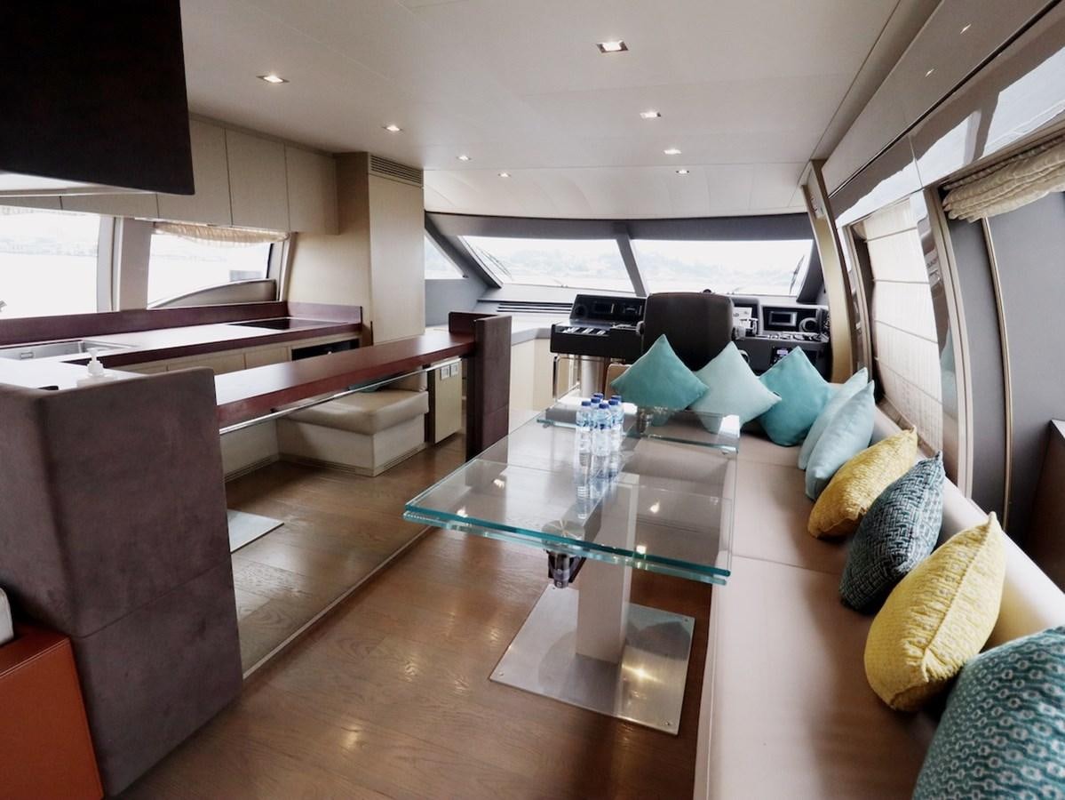a room with a bed and desk aboard SONIA Yacht for Sale