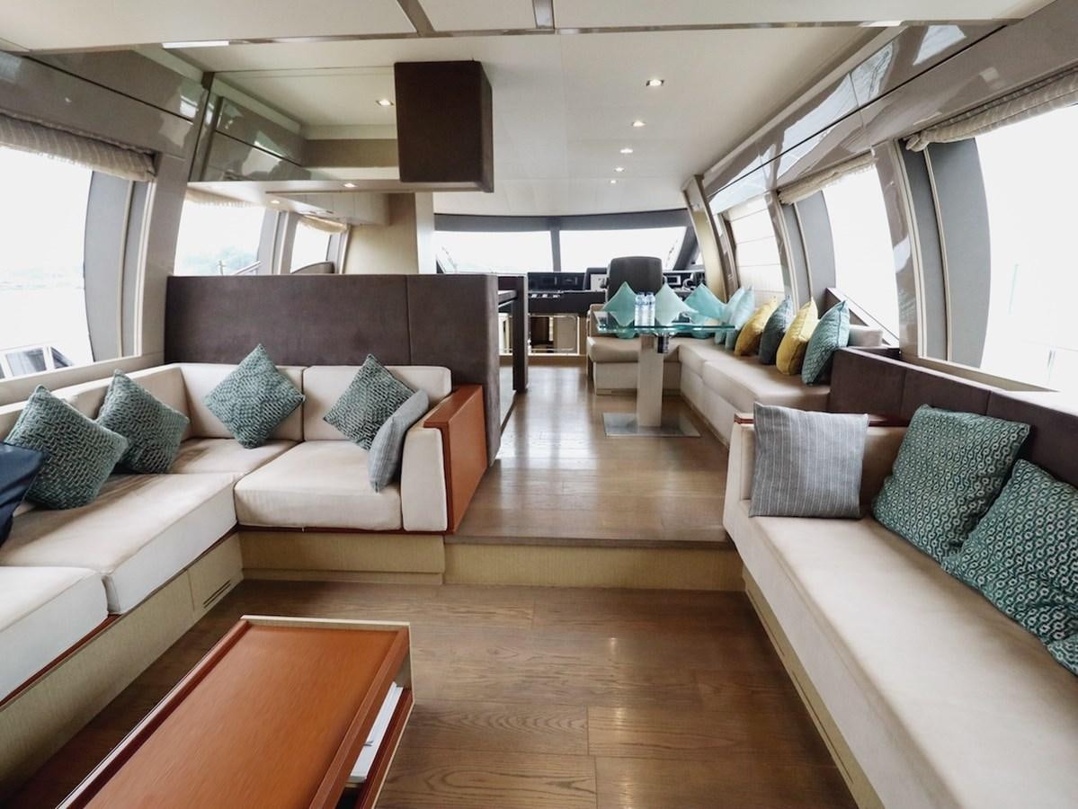 a living room with a couch and a table aboard SONIA Yacht for Sale