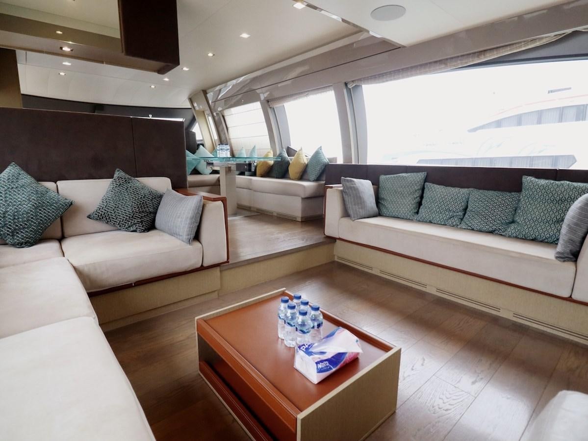a living room with a couch and a table aboard SONIA Yacht for Sale