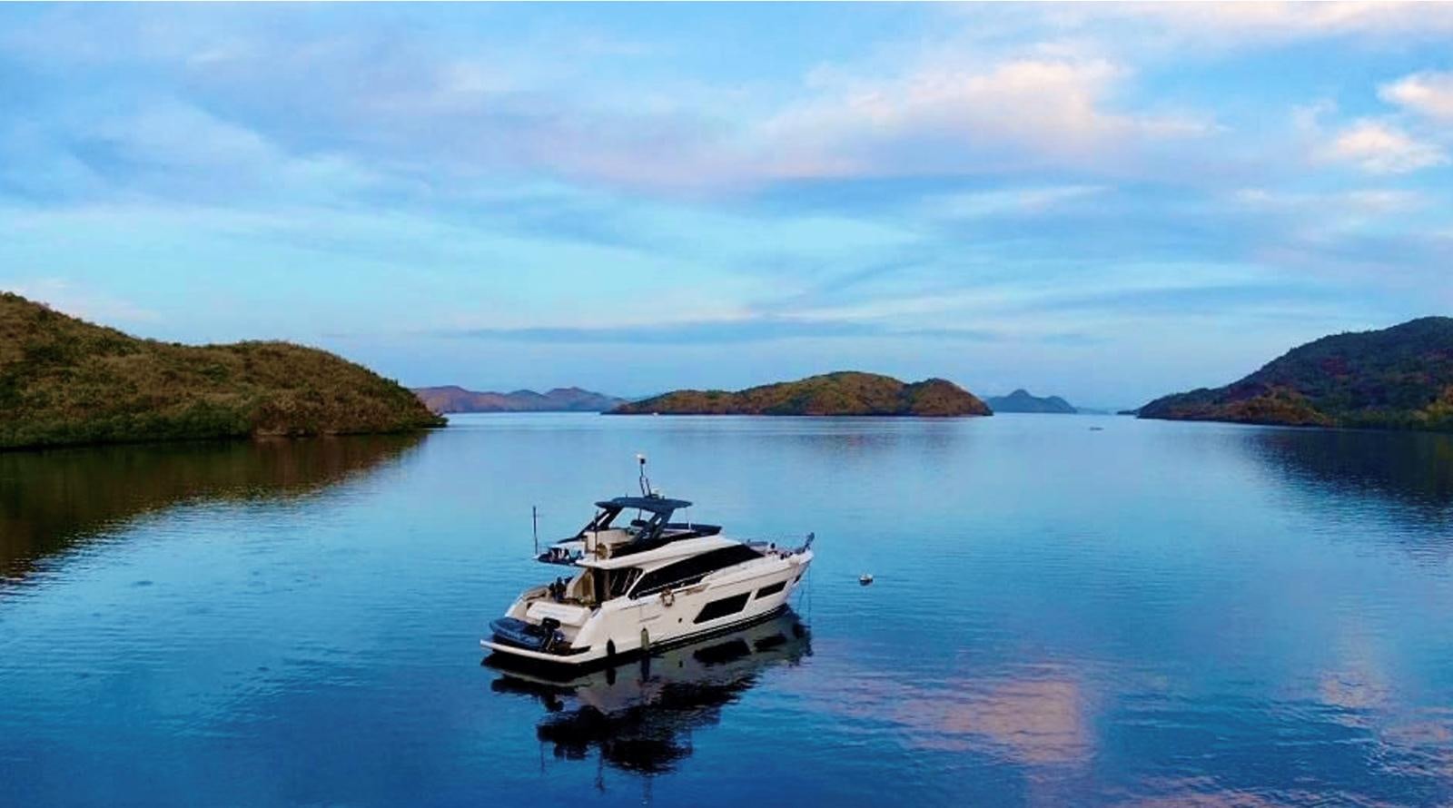 a boat in the water aboard 2020 FERRETTI 670 Yacht for Sale