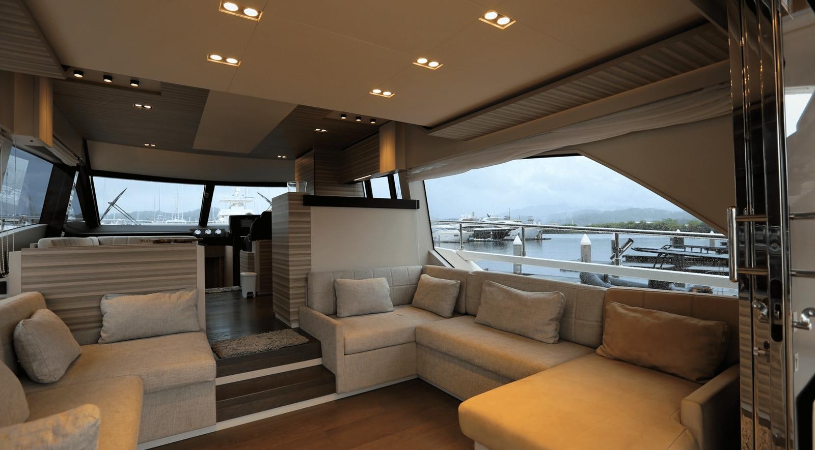 a living room with a view of the ocean aboard 2020 FERRETTI 670 Yacht for Sale