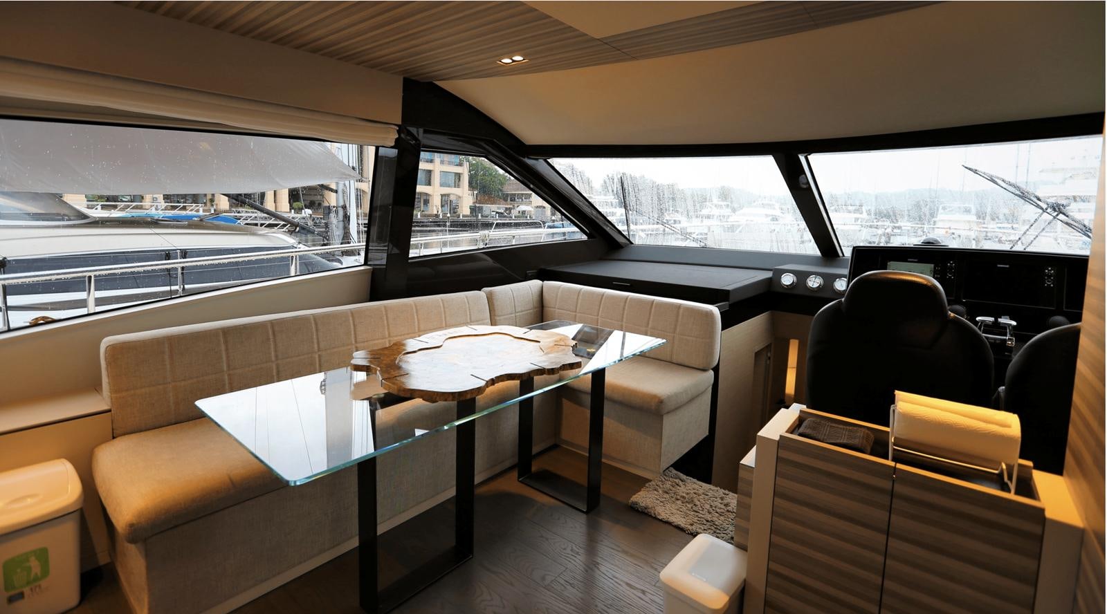 a table and chairs in a room aboard 2020 FERRETTI 670 Yacht for Sale