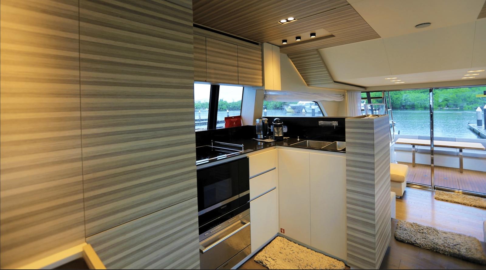 a kitchen with a sliding glass door aboard 2020 FERRETTI 670 Yacht for Sale
