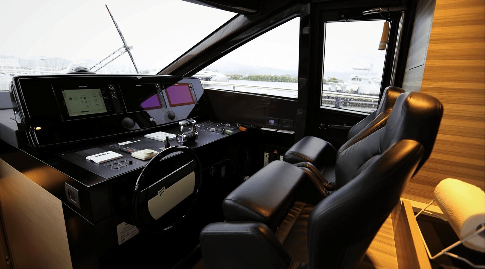 inside of a vehicle with a desk and computer screens aboard 2020 FERRETTI 670 Yacht for Sale
