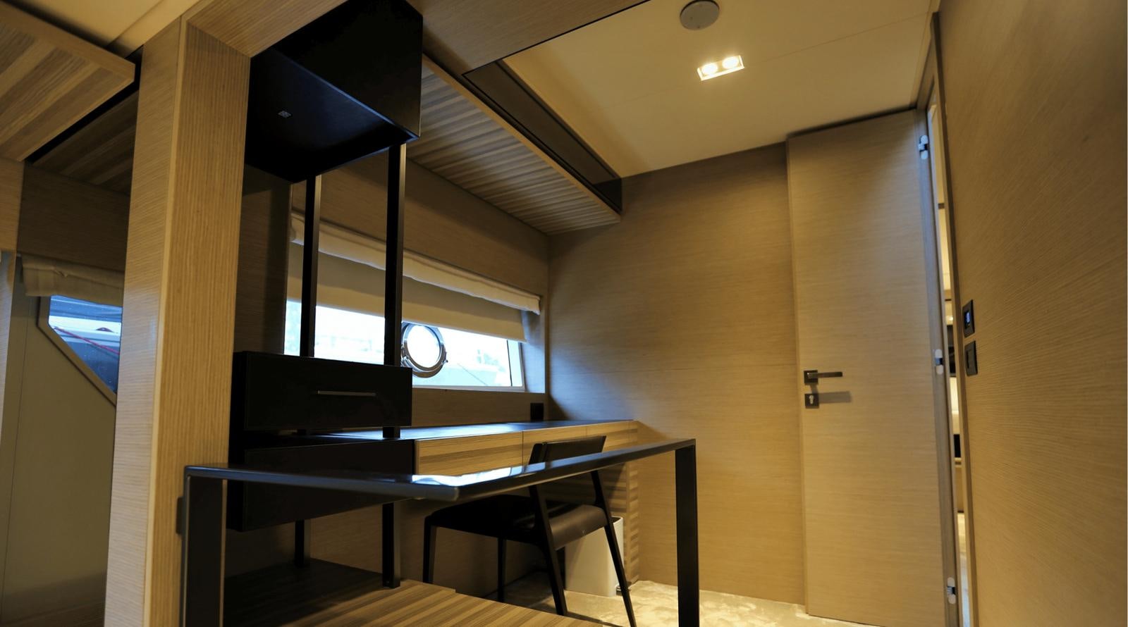 a room with a table and chairs aboard 2020 FERRETTI 670 Yacht for Sale